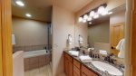 Master bathroom with double vanity sinks and granite countertops 